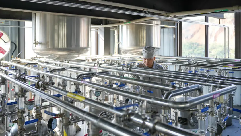 Stainless steel processing equipment in a manufacturing partner reference photograph