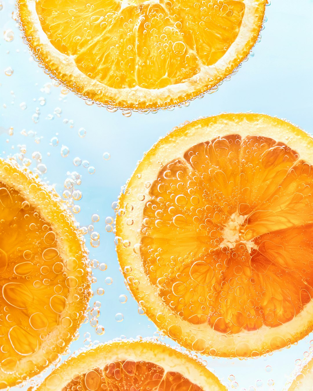 Orange slices in sparkling water representing electrolyte hydration product development
